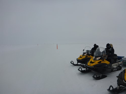 Crossing an ice road in flat light on the tundra