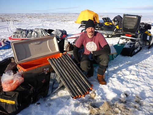 Allen posing with prized permafrost cores collected from tundra surrounding Peatball Lake